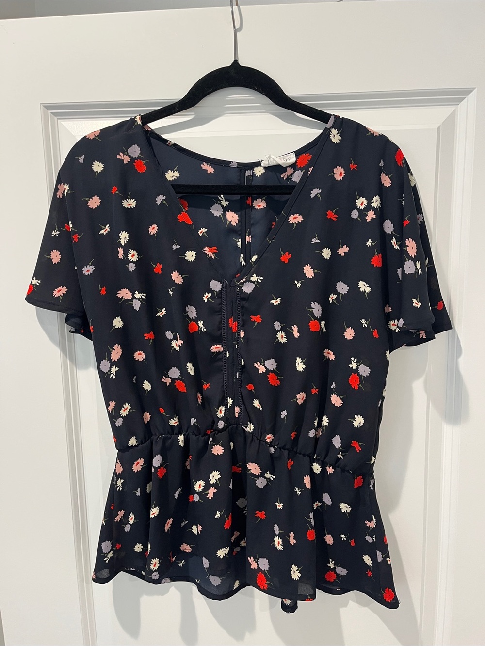 Sienna Sky Navy Floral Peplum Top with Red and Pink Accents